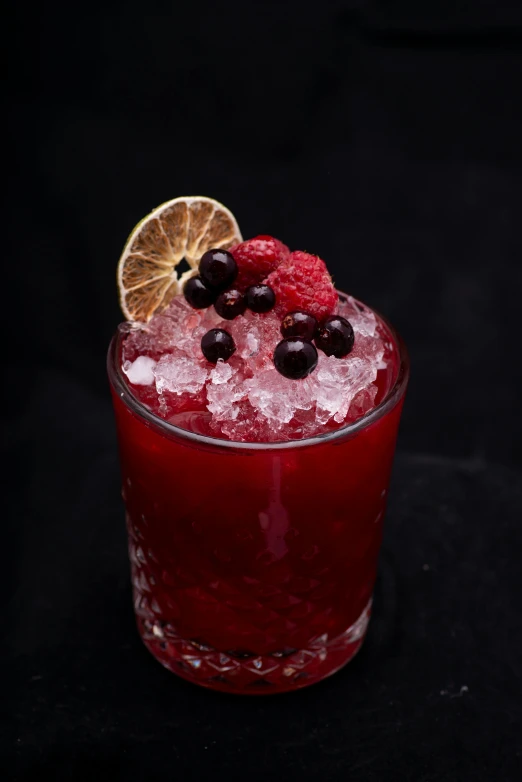 a close up of a drink in a glass on a table, rubies, slush!!, product shot, wild berries