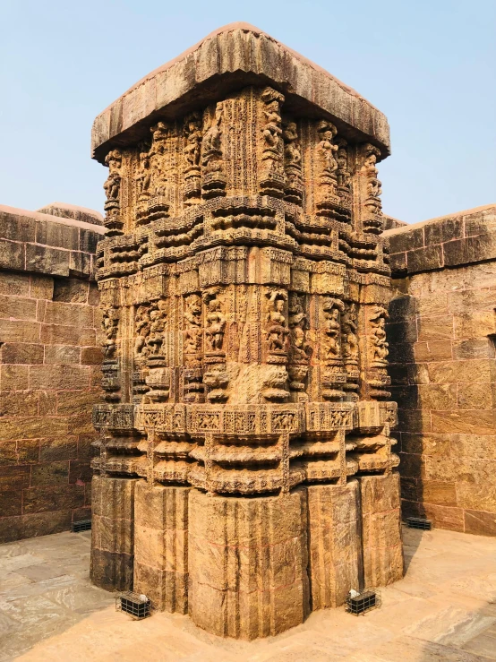 a tall stone structure with carvings on it, by Gwen Barnard, pexels contest winner, samikshavad, madhubani, pedestal, panoramic shot, high face detail