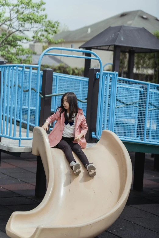 a little girl that is sitting on a slide, inspired by Ni Yuanlu, unsplash, low quality photo, jakarta, square, casually dressed