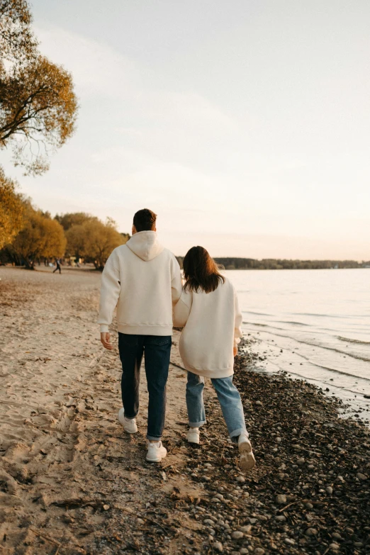 a man and a woman walking on a beach, trending on pexels, happening, lakeside, beautifully soft lit, college, low