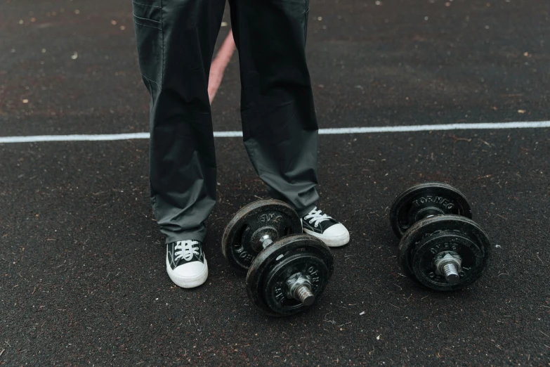 a man standing on top of a tennis court holding a tennis racquet, an album cover, by Attila Meszlenyi, pexels contest winner, happening, carrying two barbells, focus on sneakers only, an obese, 15081959 21121991 01012000 4k