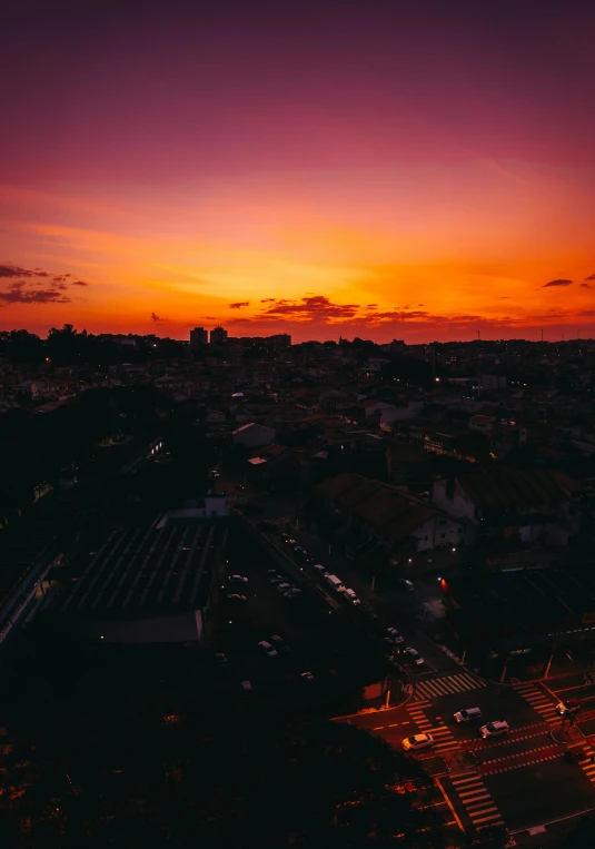 an aerial view of a city at sunset, by Alejandro Obregón, pexels contest winner, portugal, violet and yellow sunset, red skies, square