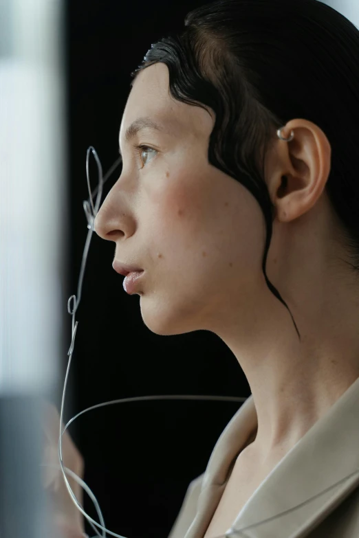 a close up of a person wearing headphones, a surrealist sculpture, inspired by Fei Danxu, hyperrealism, vocal tract model, ignant, ai researcher, androgynous person