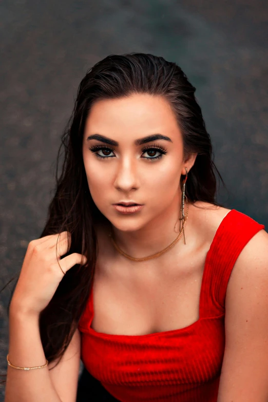 a woman in a red dress posing for a picture, by Robbie Trevino, large eyebrows, 1 8 yo, square, high quality picture