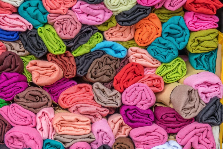 a box filled with lots of different colored clothes, by Daniel Gelon, color field, cotton fabric, curled up under the covers, 3 4 5 3 1, artisanal art