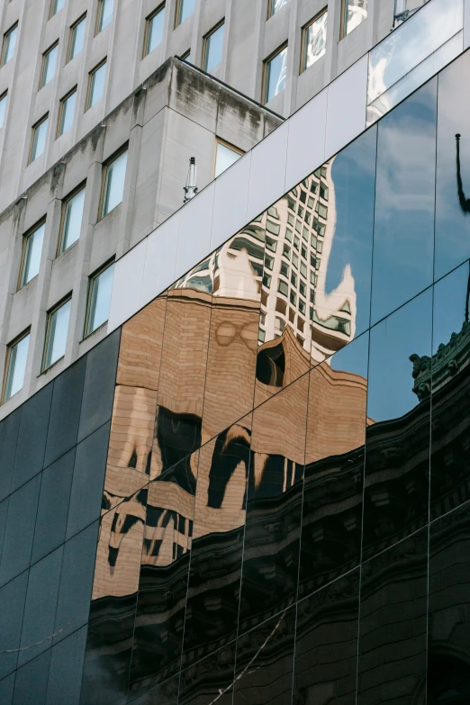 a building is reflected in the windows of another building, unsplash contest winner, public art, buenos aires, shiny surfaces, photograph taken in 2 0 2 0