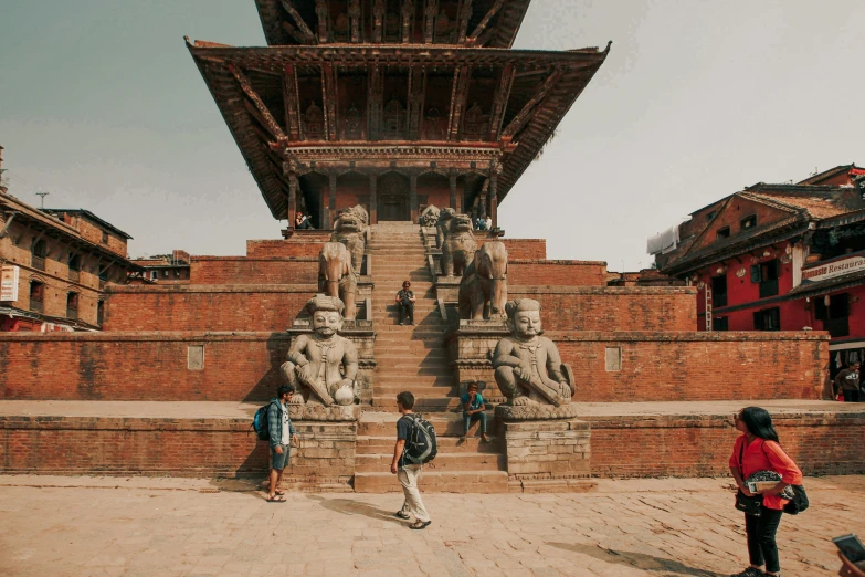 a group of people standing in front of a building, a statue, pexels contest winner, nepali architecture buildings, stepping on towers, 🦩🪐🐞👩🏻🦳, unsplash 4k