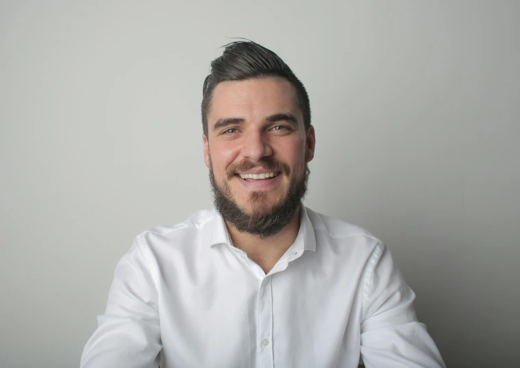 a man in a white shirt sitting at a table, avatar image, edin durmisevic, highly upvoted, professional profile picture