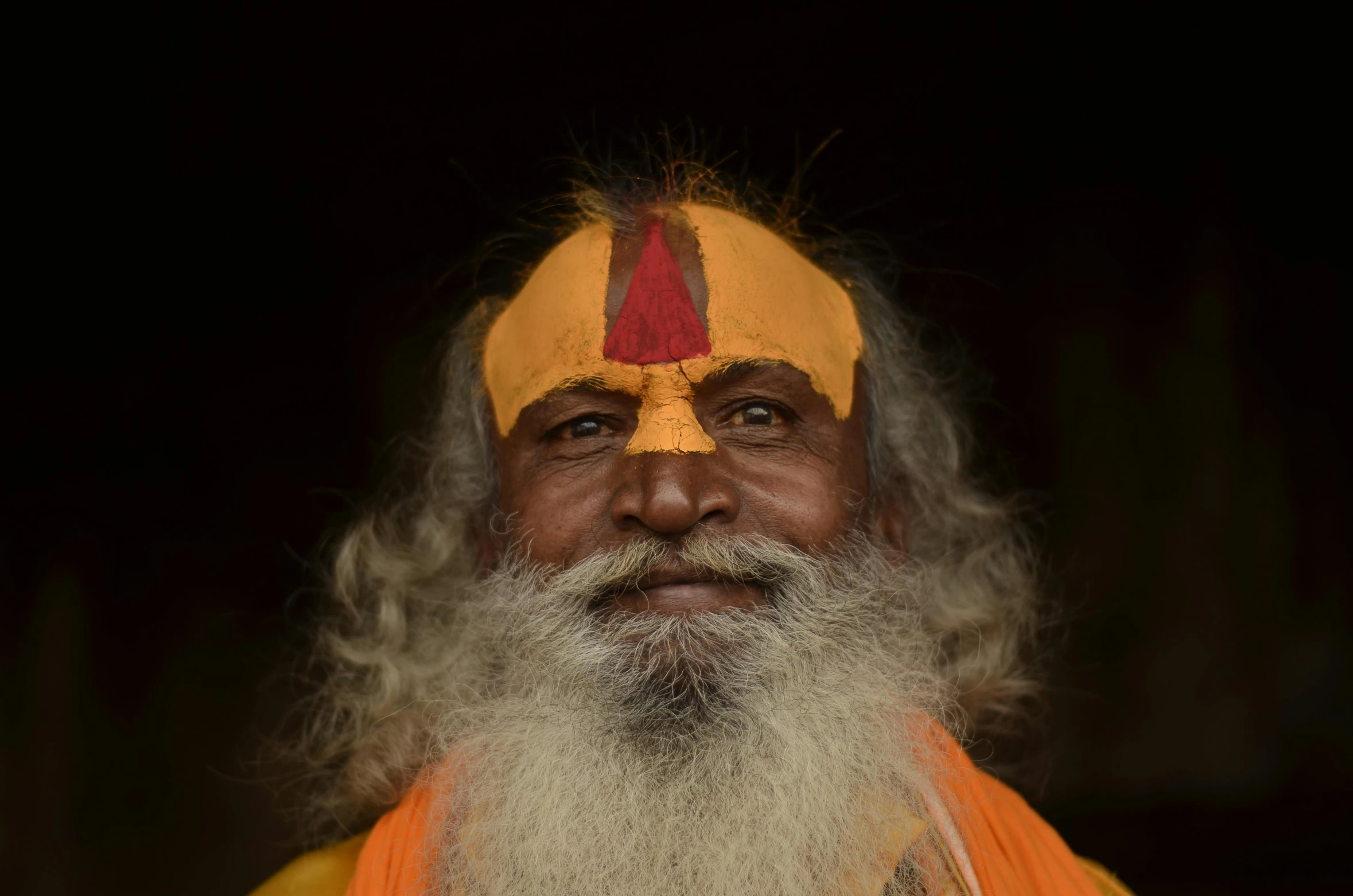 a close up of a person with a beard, pexels contest winner, bengal school of art, orange and yellow costume, nepal, avatar image, full white beard