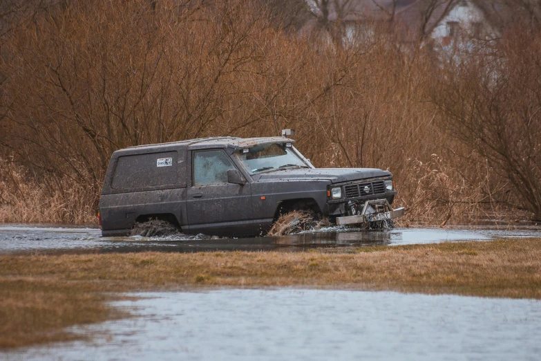 a van that is sitting in some water, by Jan Tengnagel, unsplash, auto-destructive art, all terrain vehicle race, nostalgic 8k, hunting, profile picture 1024px