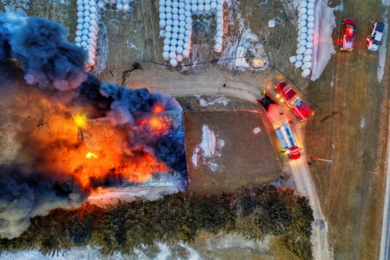 a fire that is in the middle of a field, pexels contest winner, auto-destructive art, overhead photography, barrel fires and tents, fire and ice, gettyimages