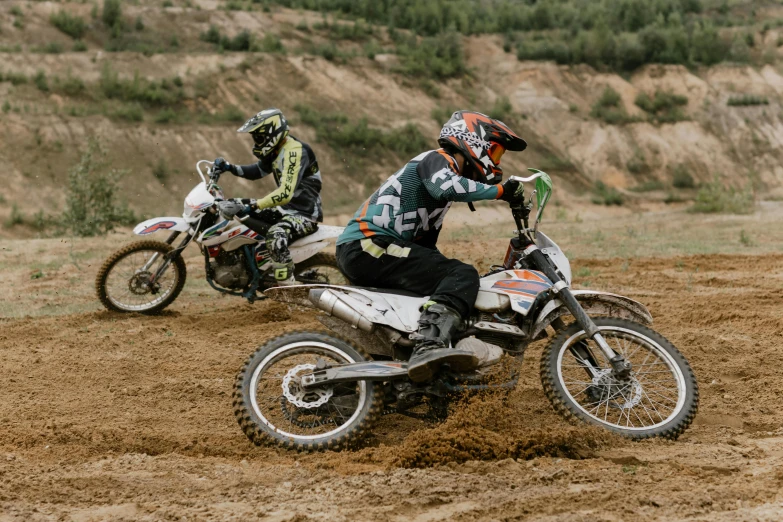 two people riding dirt bikes on a dirt track, unsplash, figuration libre, stacked image, thumbnail, tournament, 000 — википедия