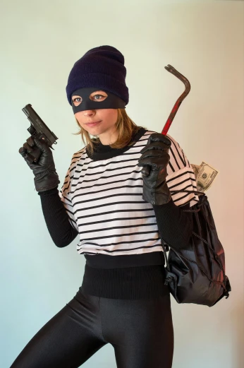 a woman dressed as a thief holding a gun, by Terese Nielsen, unsplash, where's wally, kevin mitnick as a bank robber, ski masks, teenage girl