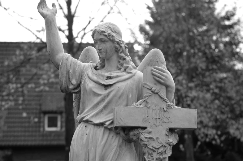 a statue of an angel holding a cross, a statue, by Caroline Mytinger, black-and-white, waving, blessing hands, cementary