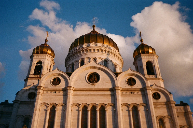 a large white building with gold domes against a blue sky, by Julia Pishtar, pexels contest winner, maroon, square, orthodox, tie-dye