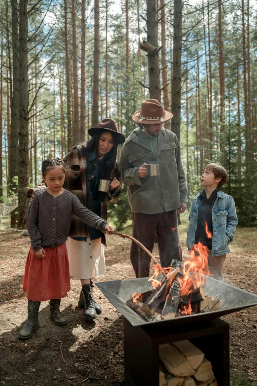 a group of people standing around a campfire, dafne keen, families playing, espoo, colonial expedition