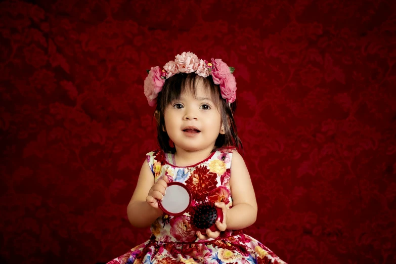 a little girl in a dress holding a mirror, by Lucia Peka, pexels contest winner, red floral dress, young cute wan asian face, 15081959 21121991 01012000 4k, award winning studio photo