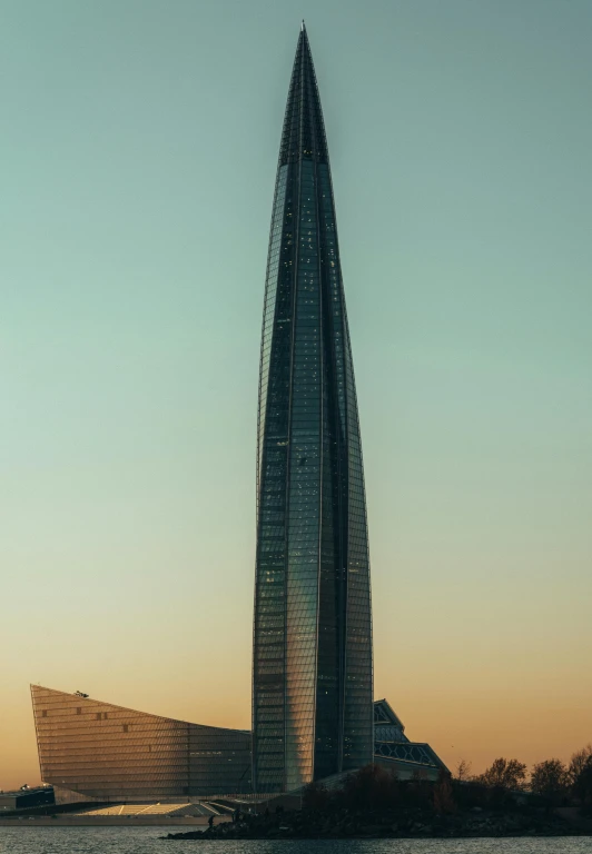 a tall building sitting next to a body of water, by Zha Shibiao, unsplash, modernism, the shard, фото девушка курит, pyongyang, portrait!!