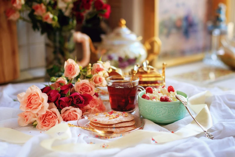 a table topped with plates of food and flowers, tumblr, rococo, tea, profile image, fan favorite, dessert