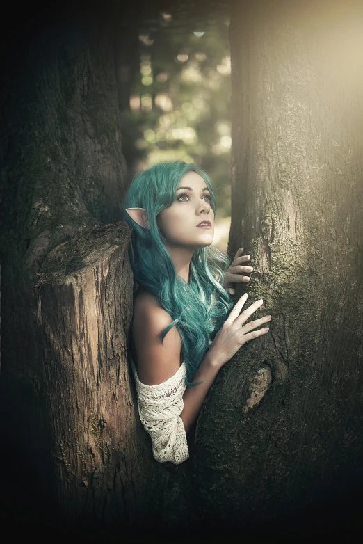 a woman with blue hair leaning against a tree, a photo, inspired by Anne Stokes, renaissance, a male elf, amy sol in the style of, fujifilm”