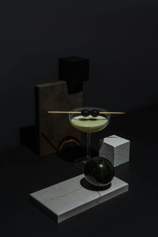 a glass filled with liquid sitting on top of a table, a still life, by Ndoc Martini, suprematism, ignant, moonlit, reuben wu, garnish