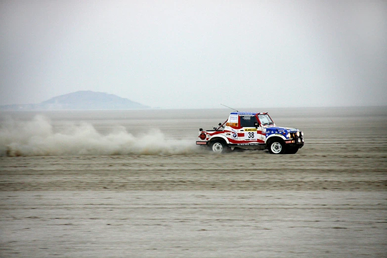 a truck that is driving in the dirt, flickr, salt flats with scattered ruins, rally car, jin shan, background image