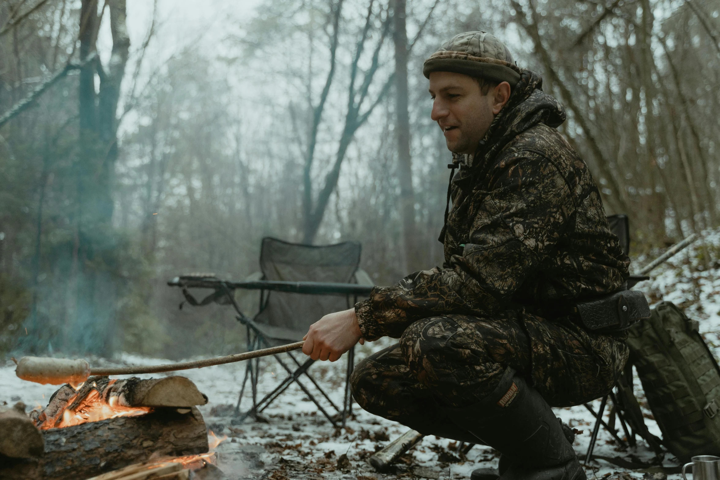 a man roasting marshmallows over a campfire, a portrait, by Emma Andijewska, multicam camo, wearing hunter coat, **cinematic, ukrainian