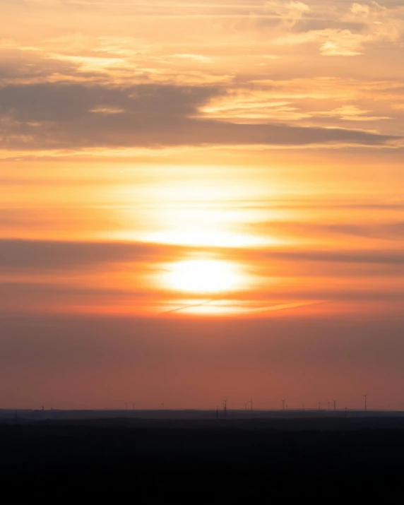 a person is flying a kite at sunset, by Jan Tengnagel, pexels contest winner, romanticism, panorama view of the sky, nuclear sunset, vast expansive landscape, today\'s featured photograph 4k