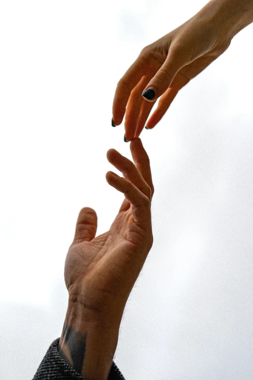 a person reaching out to touch another person's hand, pexels, minimalism, 15081959 21121991 01012000 4k, low angle shot, photographed for reuters, couple