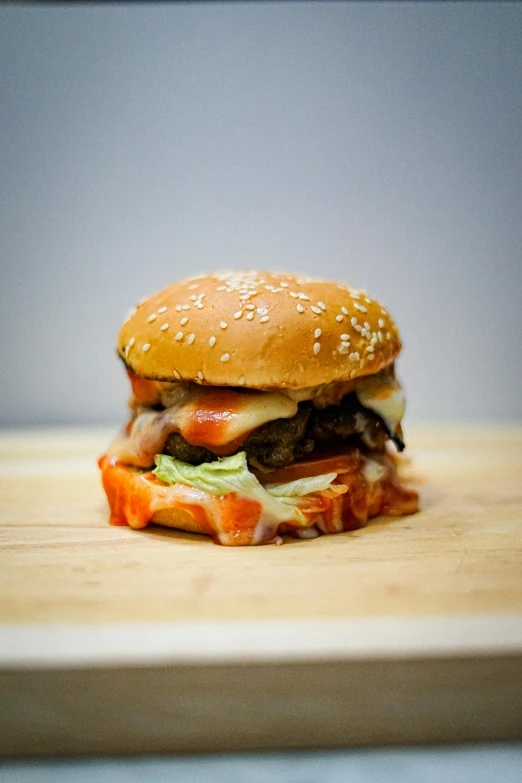 a hamburger sitting on top of a wooden cutting board, by James Morris, unsplash, 15081959 21121991 01012000 4k, frontal shot, high quality photo, belgium