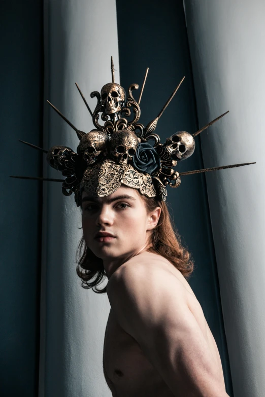 a shirtless man with a crown on his head, inspired by Hedi Xandt, unsplash contest winner, renaissance, skull helmet, emma watson wearing fancy hat, joe keery, in style of giger