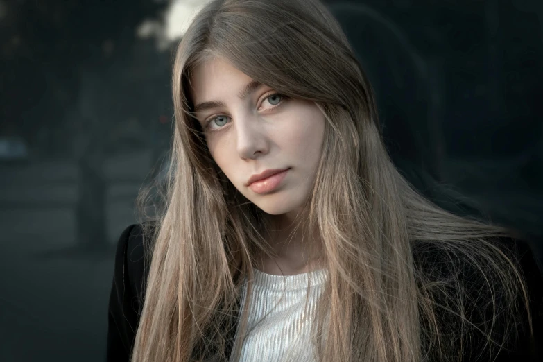 a close up of a person with long hair, inspired by Elsa Bleda, pexels contest winner, portrait of normal teenage girl, dark blond long hair, handsome girl, portrait mode photo