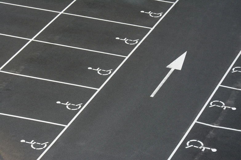 an aerial view of an empty parking lot, chalk art, by Paul Bird, dribble, on grey background, bespoke, accessible for the disabled, black chalk