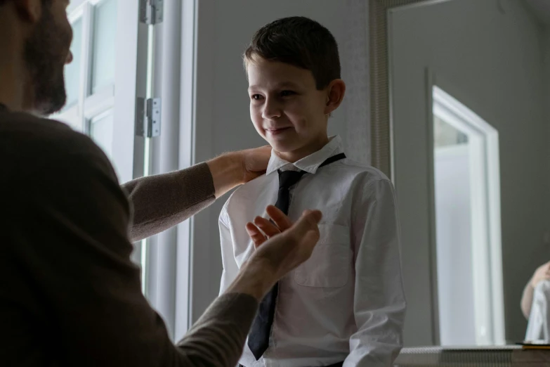 a man helping a young boy tie his tie, pexels contest winner, slender man, cinematic still, lachlan bailey, aged 13