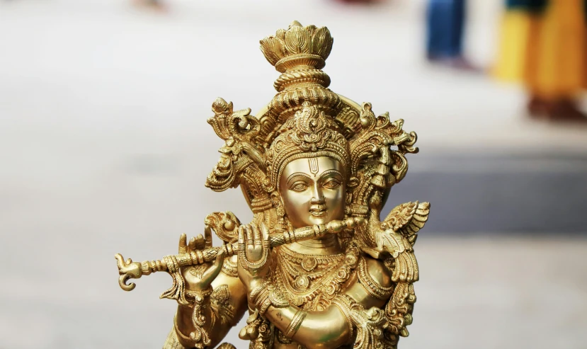 a statue of a woman holding a flute, pexels contest winner, hurufiyya, indian god, shiny gold, fan favorite, a handsome