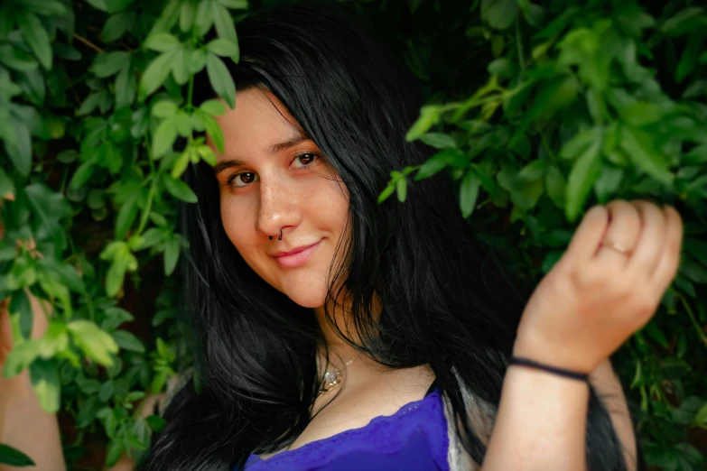 a woman with long black hair posing for a picture, lush green, profile image, avatar image, close - up photograph