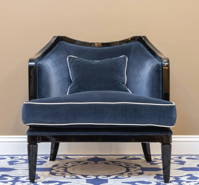 a blue chair sitting on top of a blue and white floor, inspired by William Home Lizars, baroque, on deep black velvet, frontal shot, academy award winning, armchairs