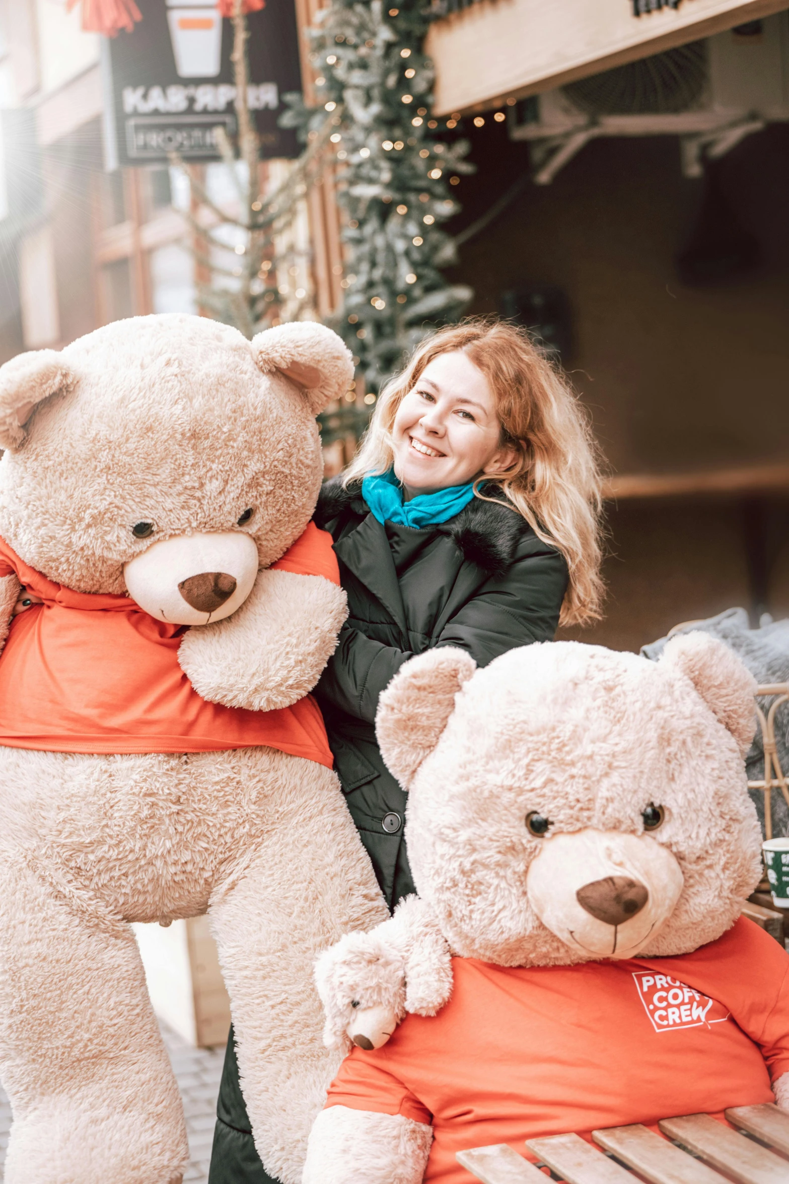 a woman standing next to a giant teddy bear, by Julia Pishtar, pexels contest winner, giving gifts to people, cute details, four humanoid bears, winter setting
