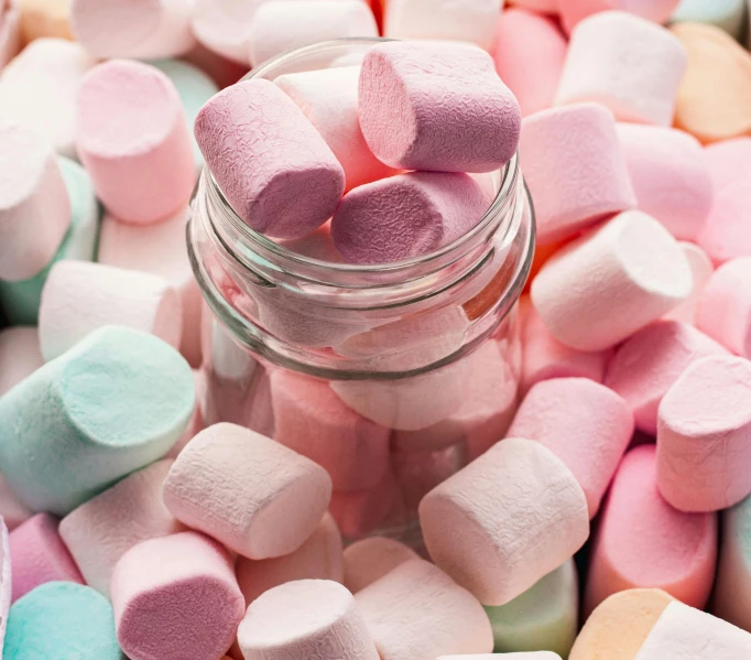 a glass jar filled with marshmallows sitting on top of a pile of other marshmallows, a pastel, by Sylvia Wishart, pexels, 2 5 6 x 2 5 6 pixels, 🎀 🧟 🍓 🧚, many cryogenic pods, chalk