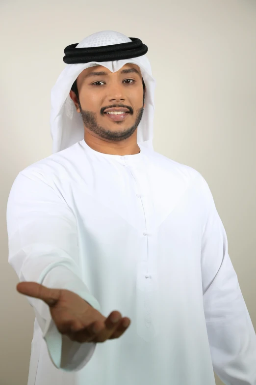 a man in a white robe holding out his hands, inspired by Sheikh Hamdullah, professional profile picture, promo image, wearing a light shirt, advertising photo