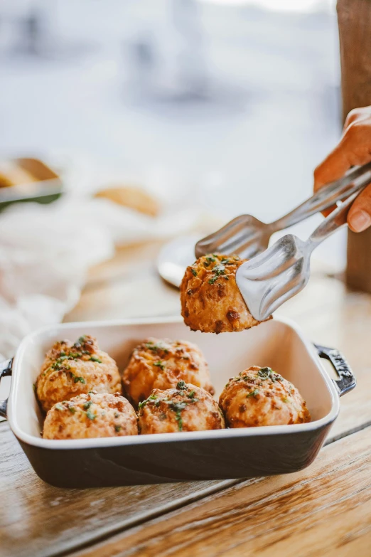 a person scooping food out of a casserole dish, inspired by Eugène Boudin, unsplash, cannonballs, 6 pack, dynamic angled shot, chicken