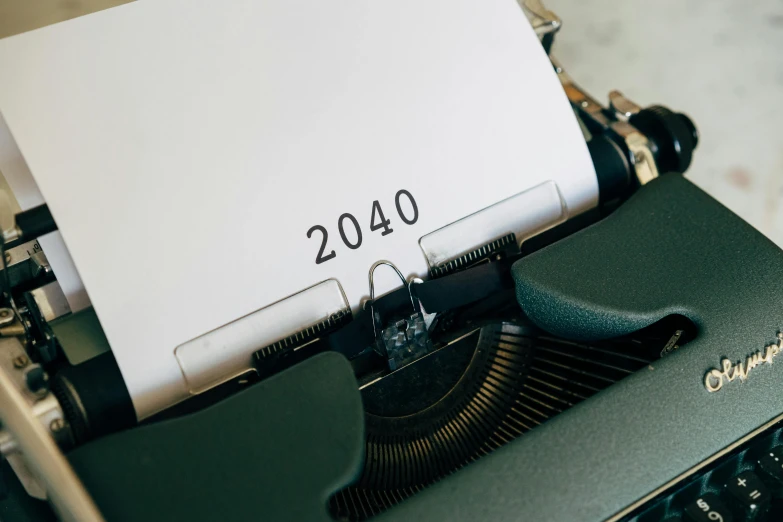 a close up of a typewriter with a paper on it, a polaroid photo, trending on unsplash, year 2 0 4 0, futuristic year 4 0 0 0, thumbnail, 4 0 years