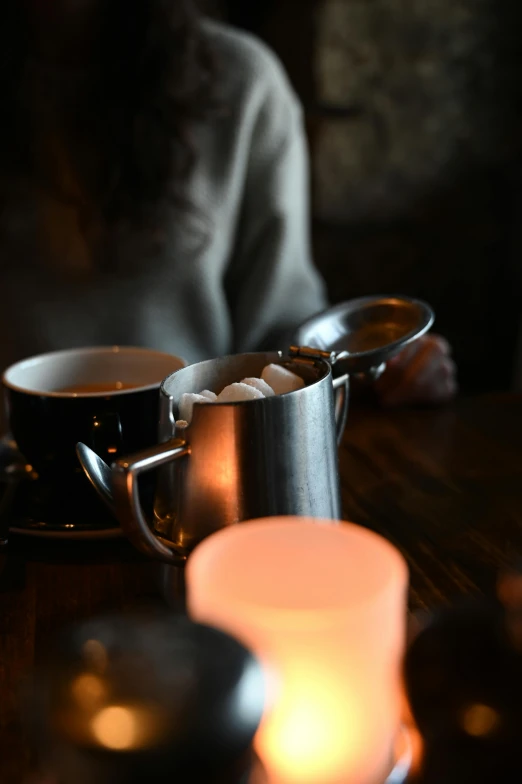 candle light and two cup of coffee on the table