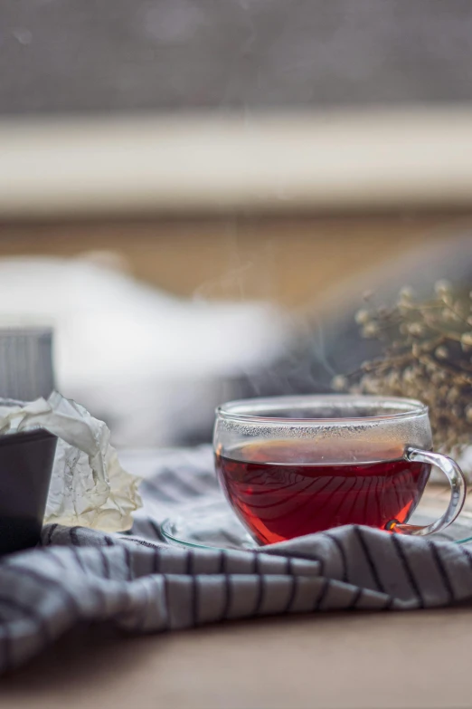 a cup of tea sitting on top of a table, a still life, pexels contest winner, romanticism, maroon mist, profile image, relaxing after a hard day, product shot