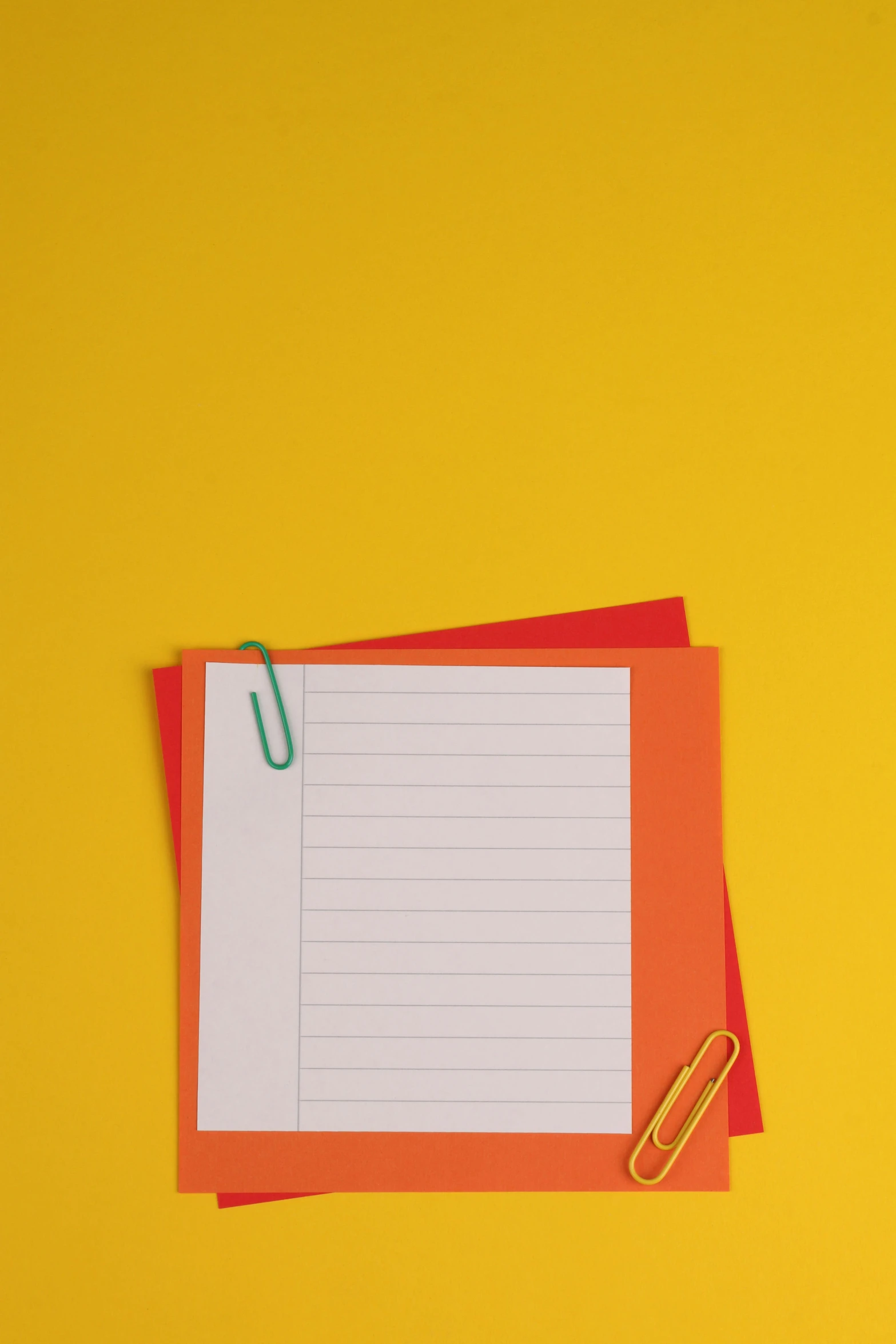 a piece of paper with a paperclip on top of it, pexels, yellow walls, bright colors with red hues, getty images, two stories