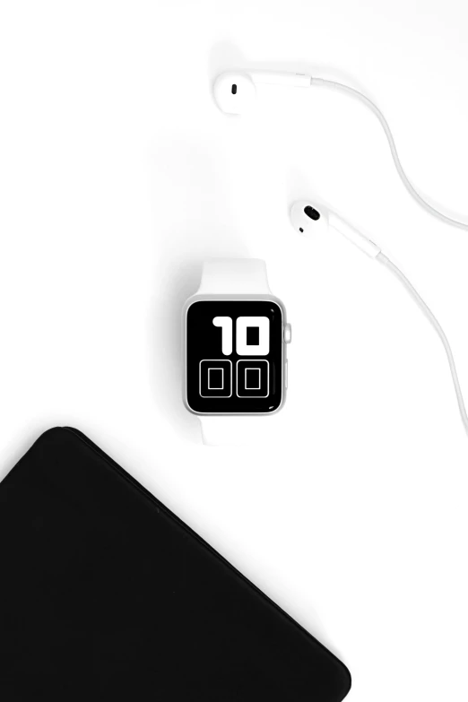 an apple watch sitting on top of a table next to headphones, by Android Jones, minimalism, 2 5 6 x 2 5 6, digital displays, white monochrome color!!!!!, led displays