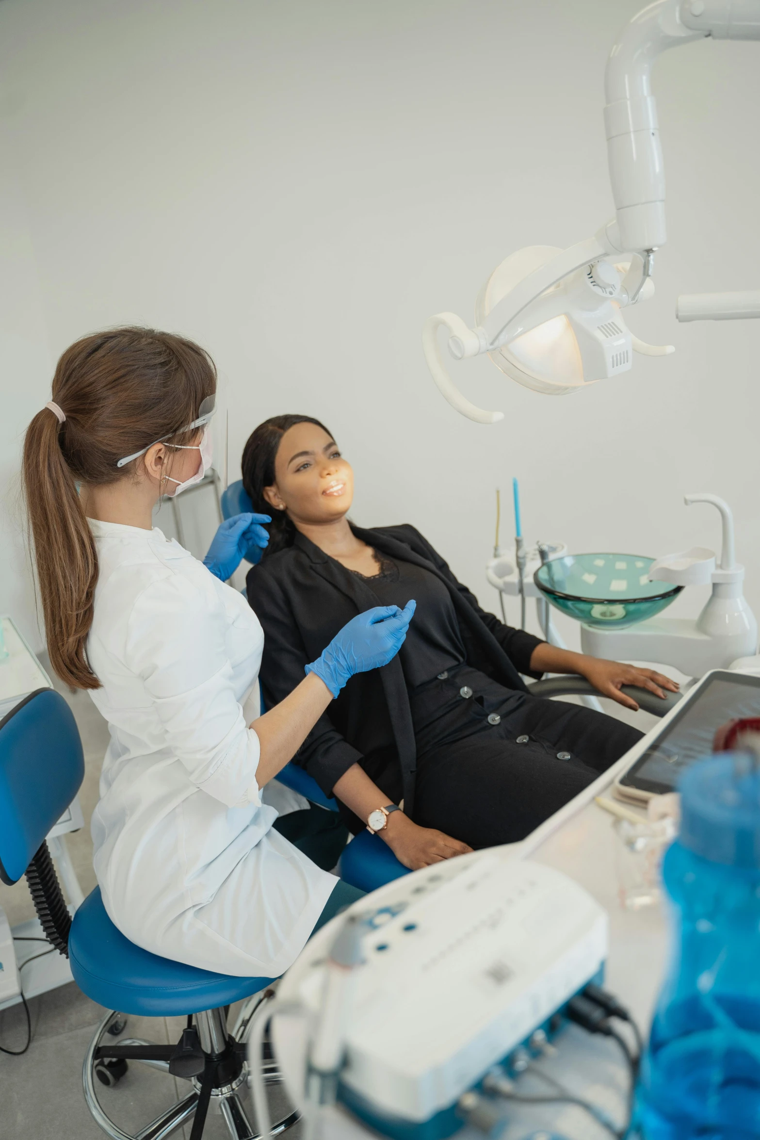 a woman getting her teeth examined by a dentist, pexels contest winner, renaissance, creepy uncanny valley, looking sad, black, 15081959 21121991 01012000 4k