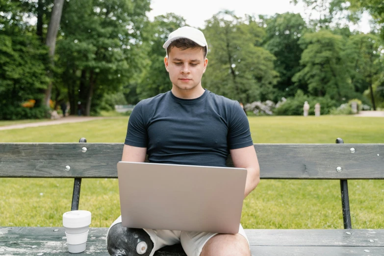 a man sitting on a bench with a laptop, dasha taran, avatar image, white male, high resolution image