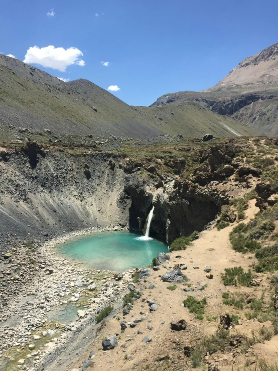 a large body of water with a waterfall on the side