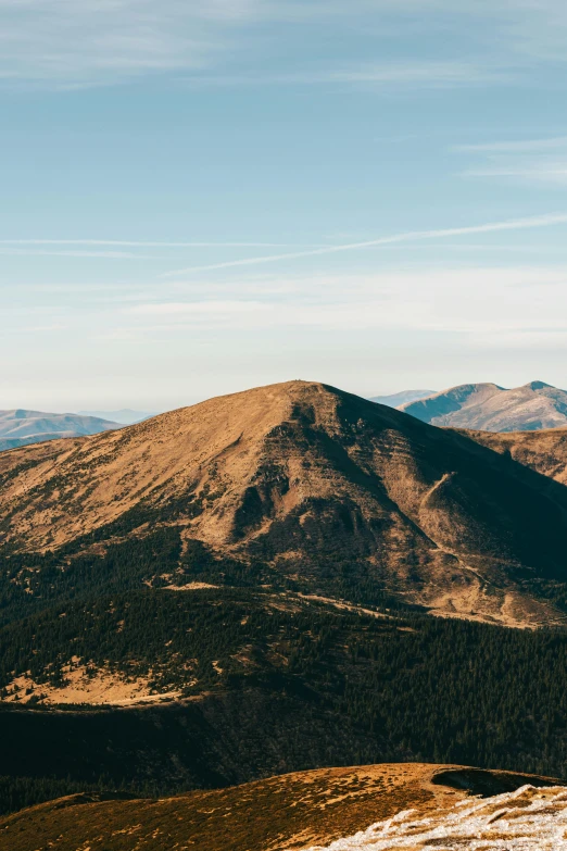 the sun is shining on the mountain landscape